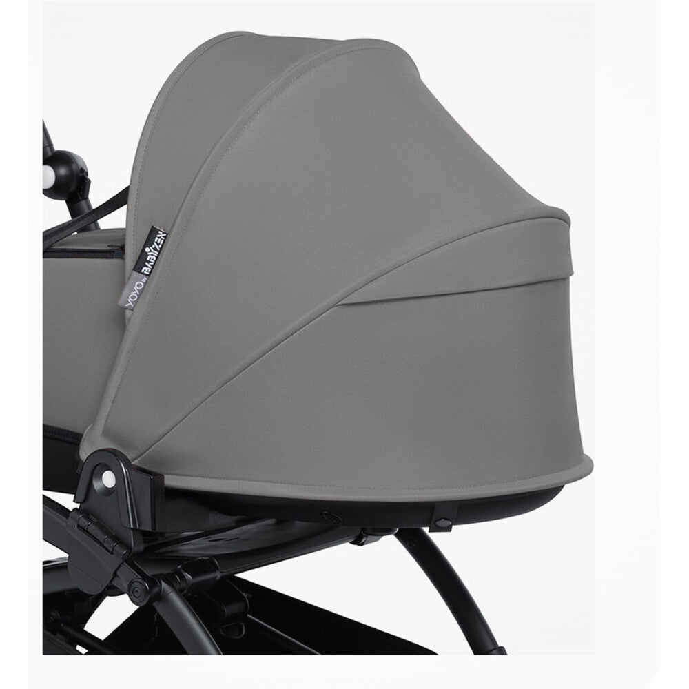 Close up of Babyzen Yoyo bassinet grey hood up