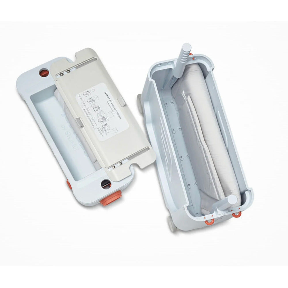 Inside Stokke Jet Kids Bed Box showing folded mattress and lid