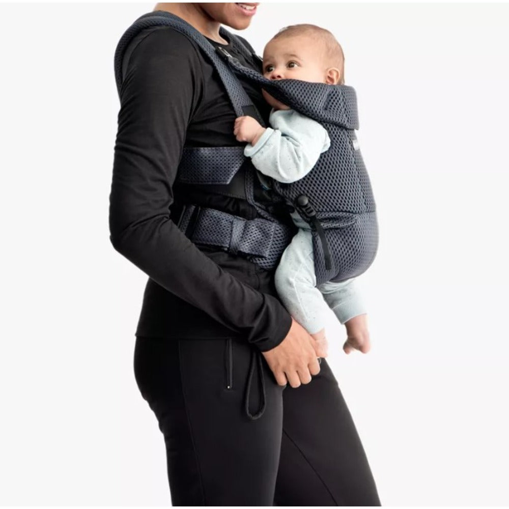 Woman carrying baby in Carrier Move