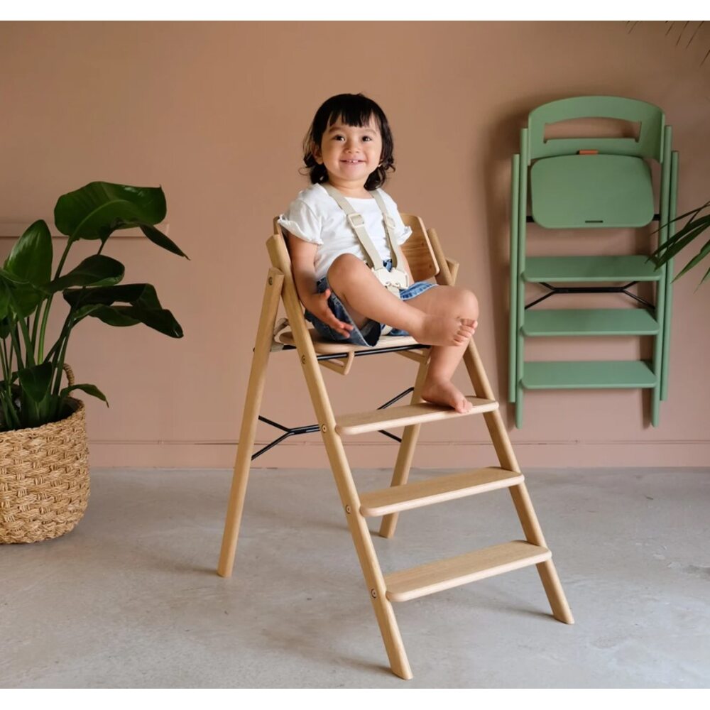 Toddler on Kaos Klapp High Chair with Harness on