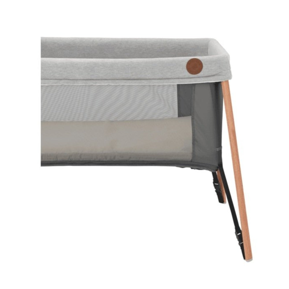 Maxi Cosi Iris Travel Cot showing the side on the higher level setting